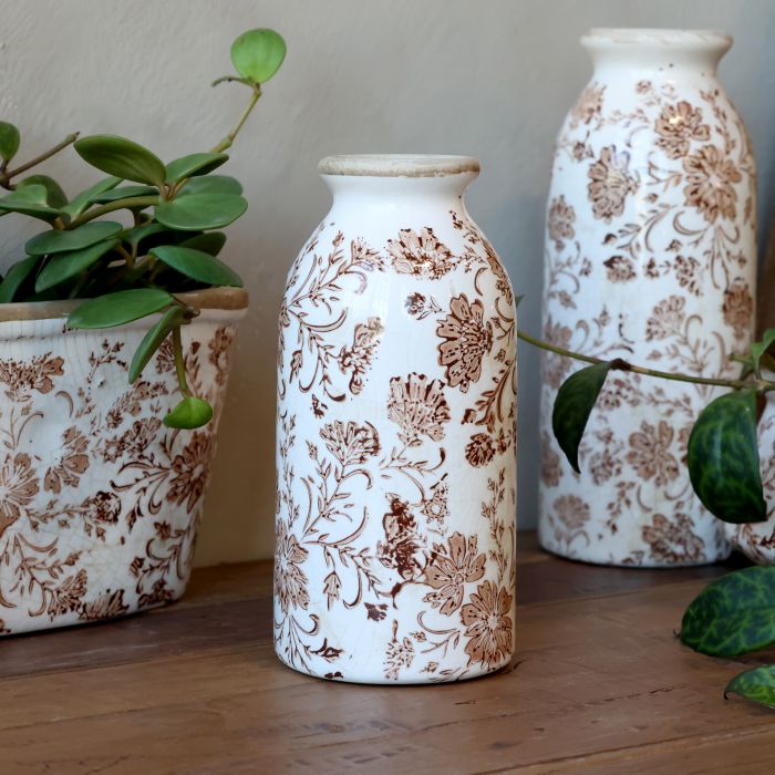 Flaske med blomstermotiv