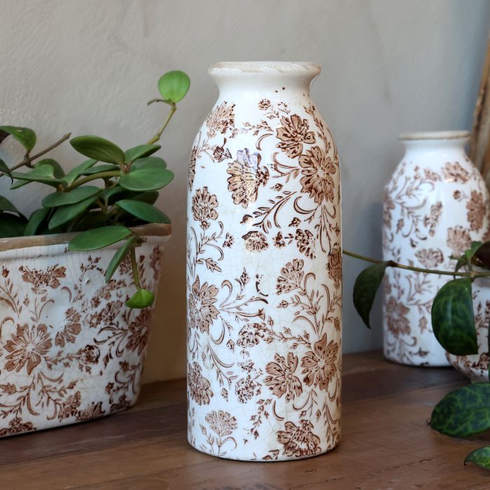 Flaske med blomstermotiv